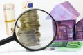 Euro bill House and expenses under magnifying glass Royalty Free Stock Photo