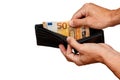 50 euro bill sticking out of black wallet hand holding money bill Royalty Free Stock Photo