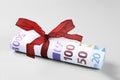 Rolled Twenty to Five Hundred Euro Banknotes with Red Ribbon Royalty Free Stock Photo