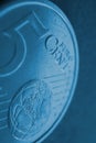 A 5 euro cent coin close-up. Dark blue vertical background about money, economy or finance of countries of the European community Royalty Free Stock Photo