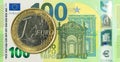 1 euro coin against 100 euro bank note second edition Royalty Free Stock Photo