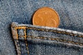 Euro coin with a denomination of 5 euro cents in the pocket of dark blue denim jeans Royalty Free Stock Photo