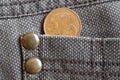 Euro coin with a denomination of 5 euro cents in the pocket of old brown denim jeans Royalty Free Stock Photo