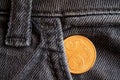 Euro coin with a denomination of 5 euro cents in the pocket of old gray denim jeans Royalty Free Stock Photo
