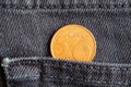 Euro coin with a denomination of 5 euro cents in the pocket of old gray worn denim jeans Royalty Free Stock Photo