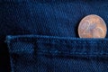 Euro coin with a denomination of 2 euro cent in the pocket of dark blue denim jeans Royalty Free Stock Photo