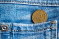 Euro coin with a denomination of 10 euro cent in the pocket of old worn blue denim jeans Royalty Free Stock Photo