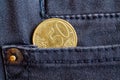 Euro coin with a denomination of 50 euro cents in the pocket of gray denim jeans Royalty Free Stock Photo