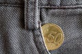 Euro coin with a denomination of 50 euro cents in the pocket of old brown denim jeans Royalty Free Stock Photo