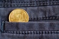 Euro coin with a denomination of 20 euro cents in the pocket of dark blue denim jeans Royalty Free Stock Photo