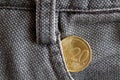 Euro coin with a denomination of twenty euro cents in the pocket of old brown denim jeans Royalty Free Stock Photo