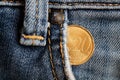 Euro coin with a denomination of twenty euro cents in the pocket of old worn denim jeans Royalty Free Stock Photo