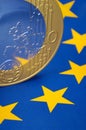Euro coin on european flag Royalty Free Stock Photo