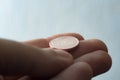 Euro coin on finger tips