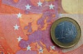 Euro coin on euro map from banknote revers Royalty Free Stock Photo
