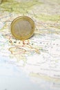Euro Coin on a Map of Greece Royalty Free Stock Photo