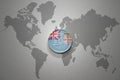 Euro coin with national flag of Fiji on the gray world map background.3d illustration