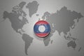 Euro coin with national flag of laos on the gray world map background.3d illustration