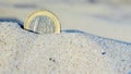 Euro coin in the sand Royalty Free Stock Photo