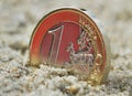 Euro coin on sand. Royalty Free Stock Photo