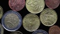 Euro coins cents on a black background close-up. Play of light and rotation. Macro photography. Flat lay. Financial crisis and Royalty Free Stock Photo