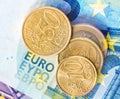 Euro coins on euro banknotes background