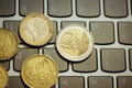 Euro coins on laptop& x27;s keyboard Royalty Free Stock Photo