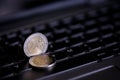 Euro coins on laptop& x27;s keyboard Royalty Free Stock Photo