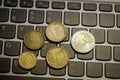 Euro coins on laptop& x27;s keyboard Royalty Free Stock Photo