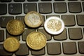 Euro coins on laptop& x27;s keyboard Royalty Free Stock Photo