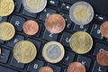 Euro coins lie on the laptop keyboard, close-up Royalty Free Stock Photo