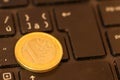 Euro coins lie on a laptop keyboard. Close up, space for text. C Royalty Free Stock Photo