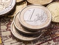 Euro coins over the old world map. Royalty Free Stock Photo