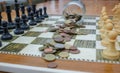 euro coins scattered on a chessboard Royalty Free Stock Photo