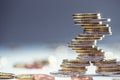 Euro coins stacked on each other in different positions. Close-up european money and currency