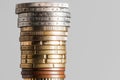 Euro coins stacked in a tower on a gray background, close-up Royalty Free Stock Photo