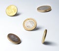 Euro coins in an unstable position on the edge. Clear shadows. Close quarters. Symbol of finance, money circulation, market Royalty Free Stock Photo