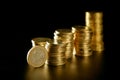 Euro currency coin columns with golden reflections