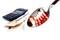 EURO currency with financial calculator and Teaspoonful pharmaceutical. Royalty Free Stock Photo