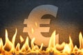 Euro currency symbol burning in fire flames