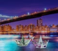 Euro and dollar boats against cityscape Royalty Free Stock Photo