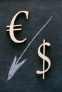 Euro and Dollar sign and a white down arrow on a black background. Financial Crisis.Exchange rate and Euro dollar Price Royalty Free Stock Photo