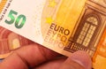 Euro, European Union Currency. A man holding a fifty euro bill. Close-up photo. Royalty Free Stock Photo