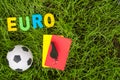 Euro football championship - image with ball, referee yellow, red card on green lawn. Symbol of soccer and fair play