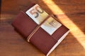 50 euro and leather bound notebook Royalty Free Stock Photo