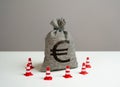 Euro money bag blocked by road cones. Royalty Free Stock Photo