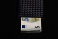 5 Euro money banknotes in black wallet isolated Royalty Free Stock Photo