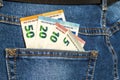 Euro money banknotes in a pocket of blue jeans close up Royalty Free Stock Photo