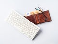 Euro money banknotes in wallet, keyboard and glasses, online banking, business, student loan concept