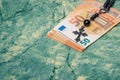 Euro money and black rosary